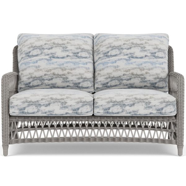 Mackinac Wicker Loveseat in Putty/Stratosphere Cloud by Lloyd Flanders