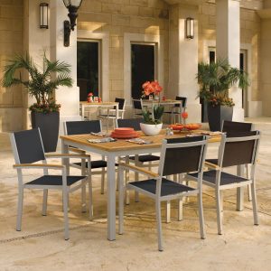 Oxford Garden Travira 7 Piece Flint Aluminum Patio Dining Set W/ Black Sling Armchairs & 63-Inch Rectangular Natural Tekwood Table